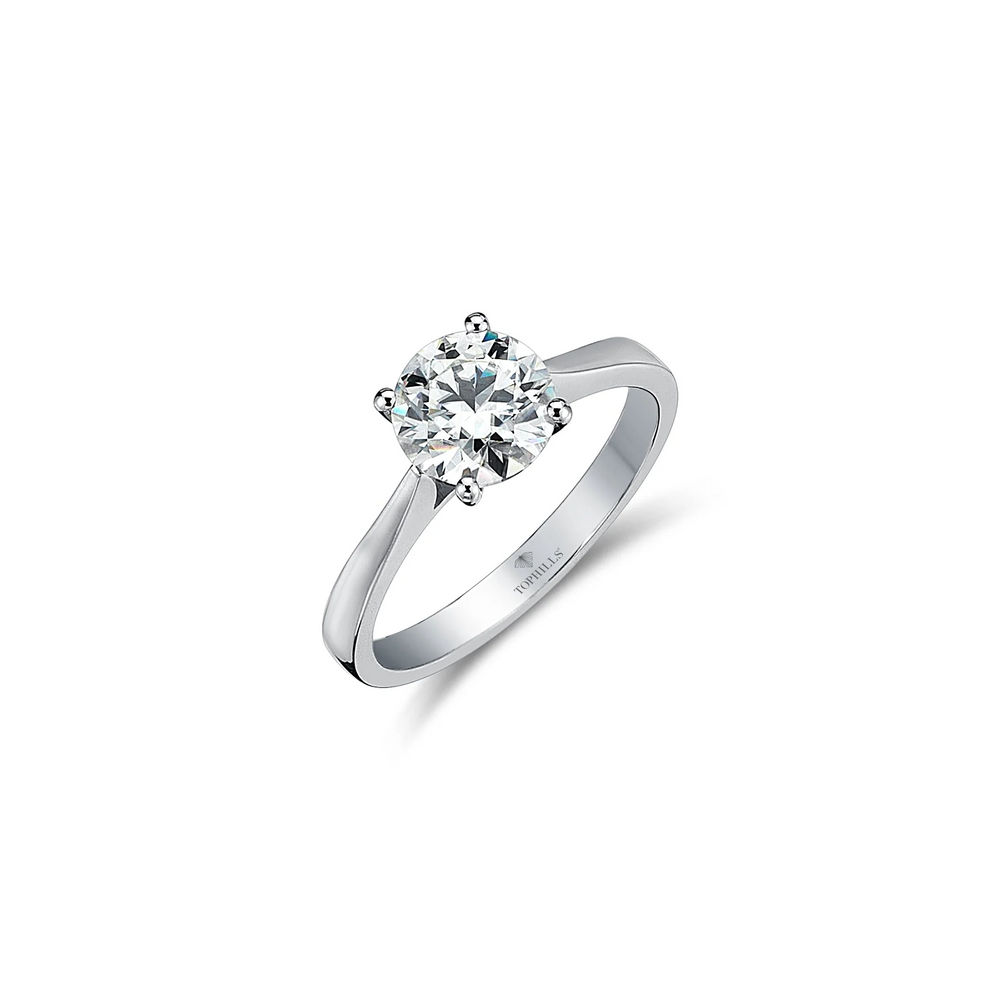 Bague solitaire en or hybride à quatre griffes et diamants